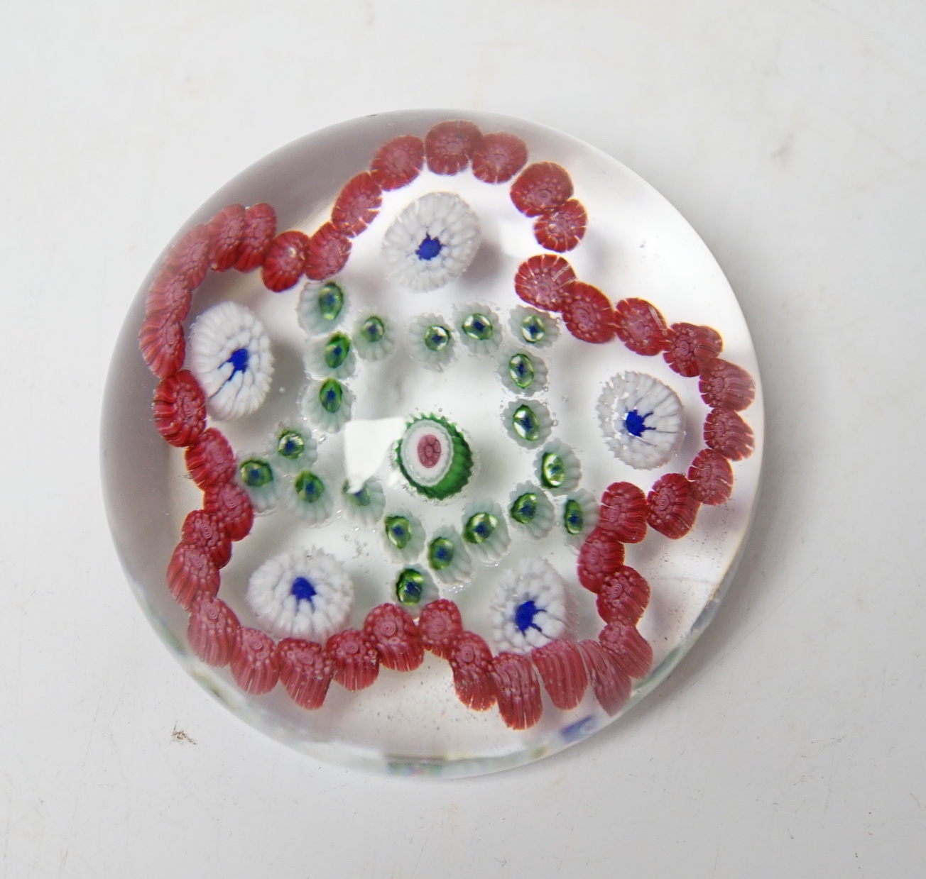 A Baccarat garlands glass paperweight, 7cm diameter